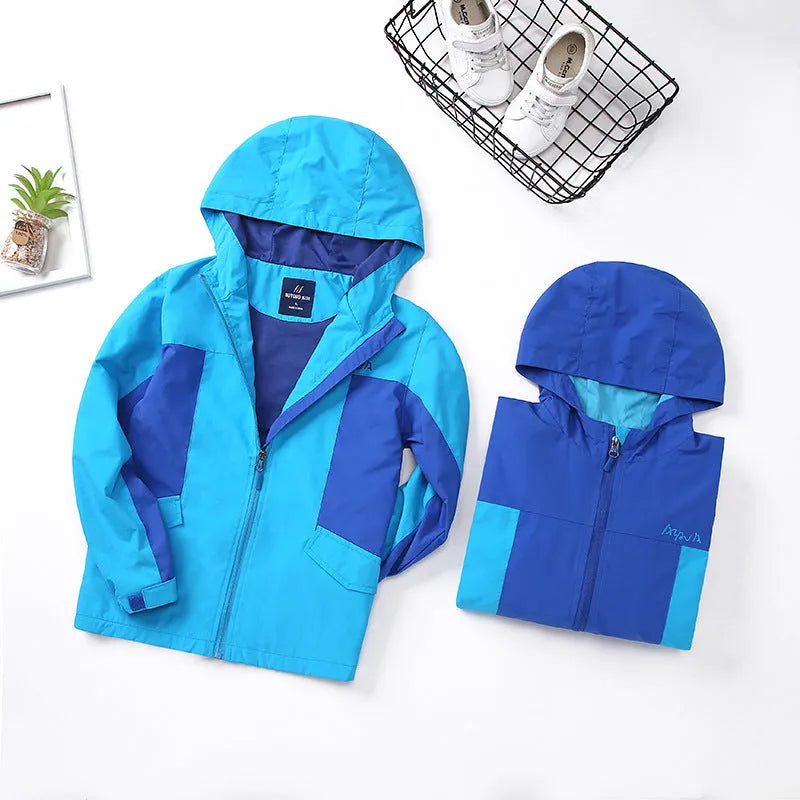 Blue children's long sleeve jacket with front zipper, shown on a hanger.