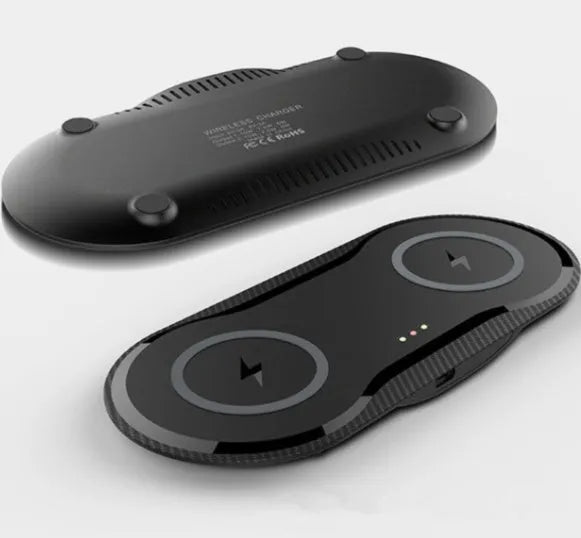 Black and white dual wireless charger charging two smartphones simultaneously on anti-slip silicone base