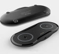 Black and white dual wireless charger charging two smartphones simultaneously on anti-slip silicone base
