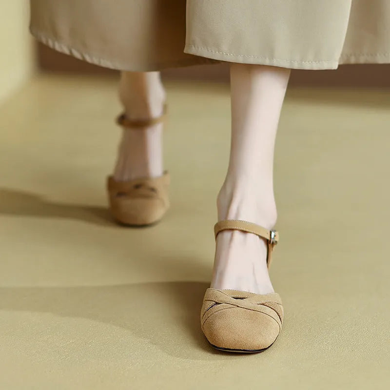 Apricot coloured classic Roman sandals with a buckle fastening and round toe on a rubber sole.
