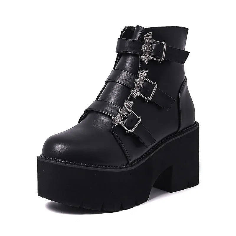 Black women's punk gothic ankle boots with bat buckle, side zip, and thick heel.