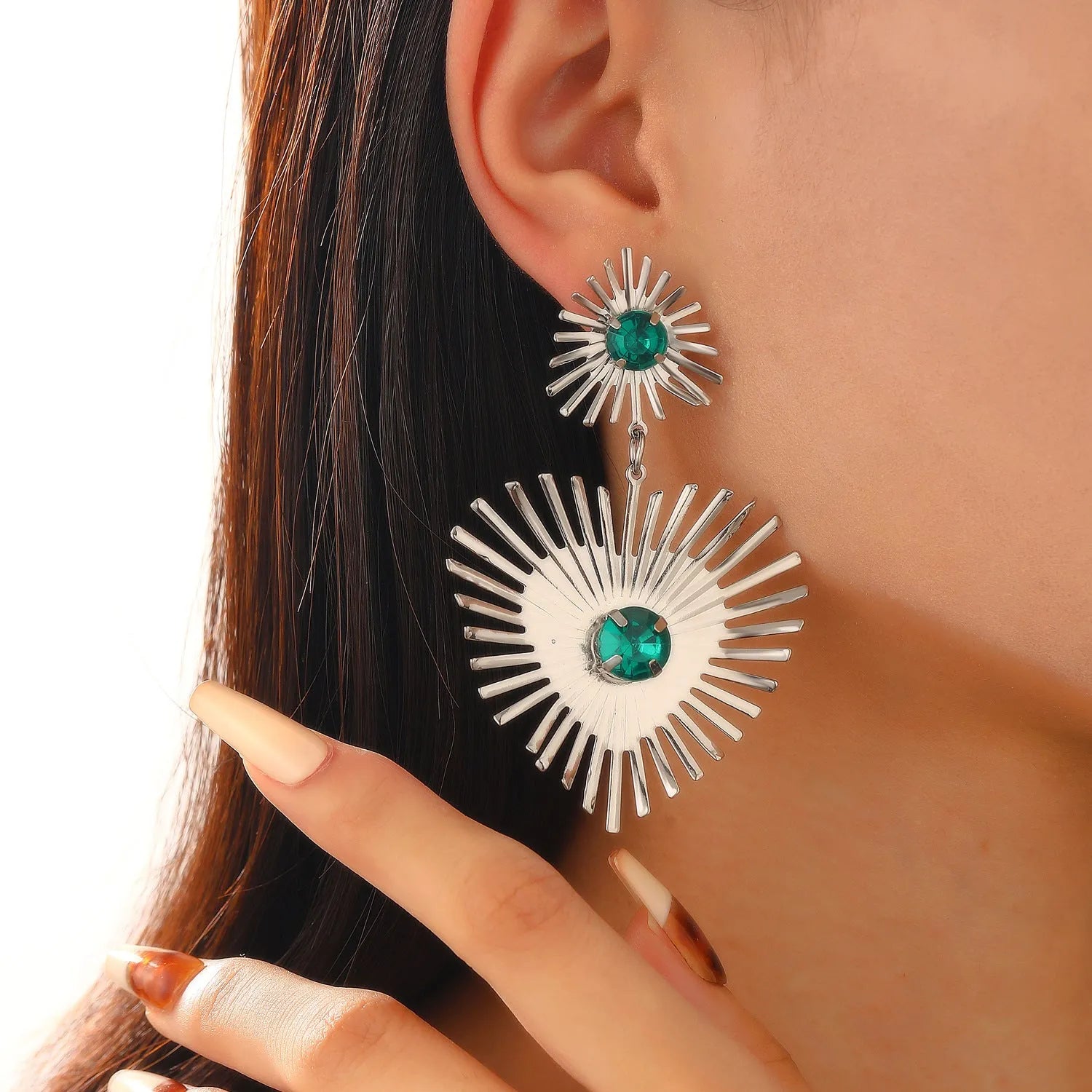 Bohemian sunflower heart-shaped earrings with rhinestones in gold finish on a white background