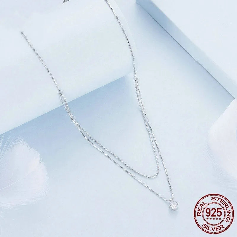 Double-layer sterling silver necklace with pearl chain and silver pendant