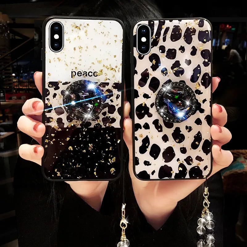 Leopard print pattern TPU back cover case for a mobile phone on a table.
