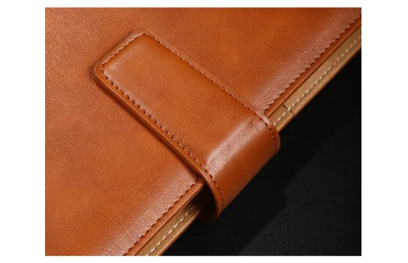 A5 leather notebook with 6-hole binder clip closure and hard cover
