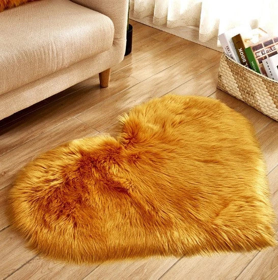 Soft and plush heart-shaped rug in various colors, perfect for cozy home decor