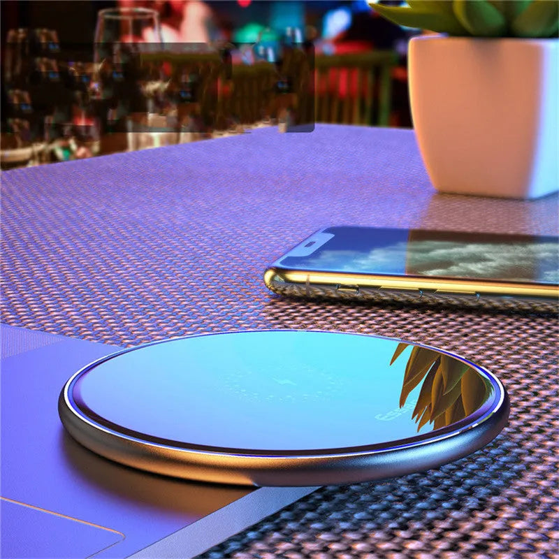 Black wireless charging pad with LED indicator for phones and headphones