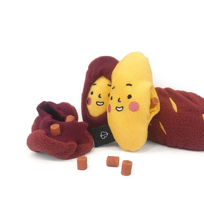 Red sweet potato shaped dog puzzle toy with hidden treat compartment