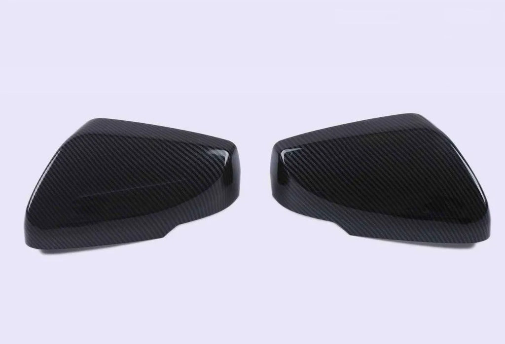 Set of ABS plastic mirror covers for Cadillac CT5 CT6 in carbon fibre, silver, and rain frame styles.