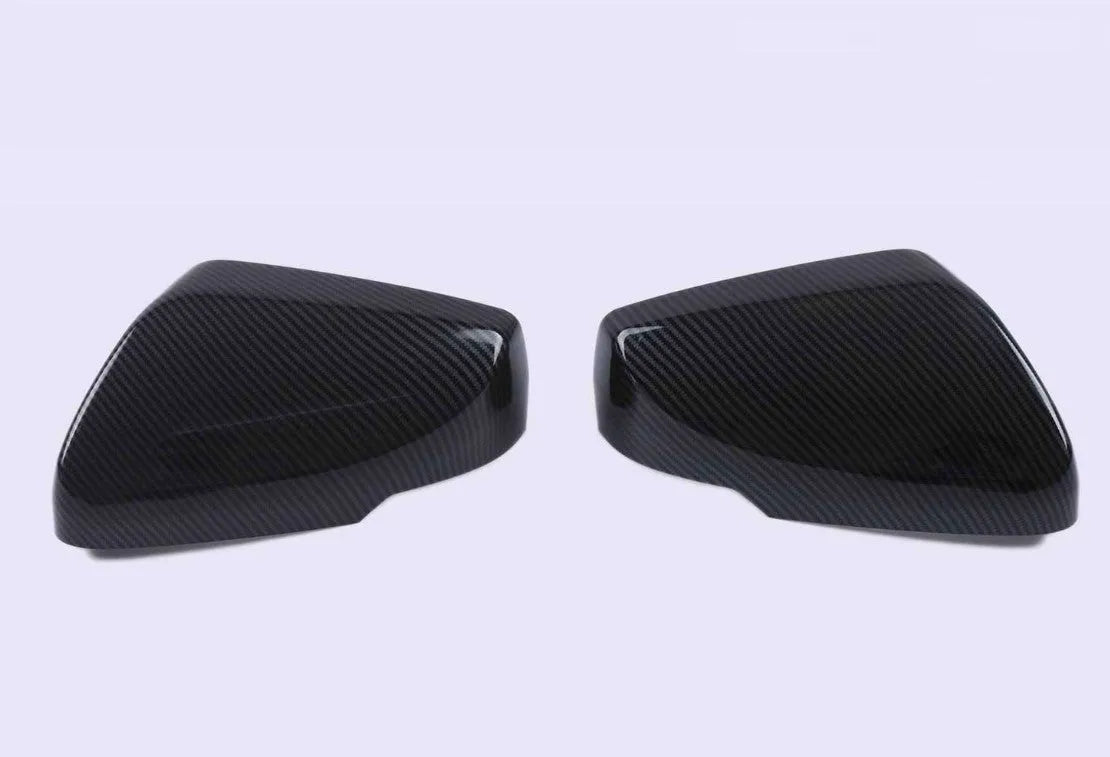 Set of ABS plastic mirror covers for Cadillac CT5 CT6 in carbon fibre, silver, and rain frame styles.
