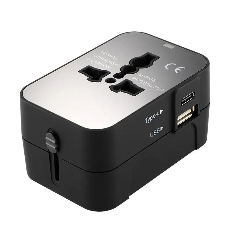 Black universal travel adapter plug with USB port and child safety door for international power conversion