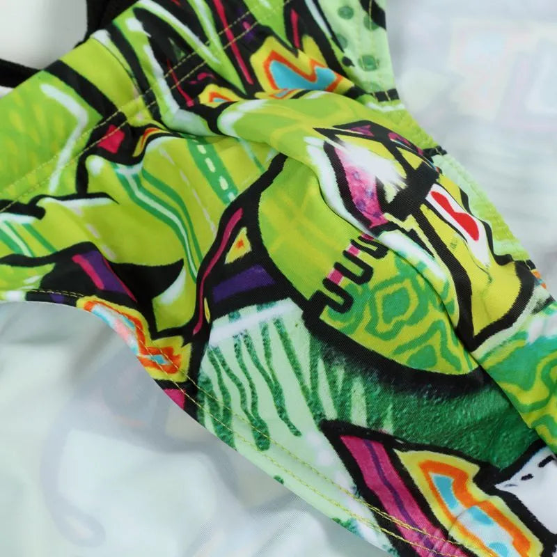 Men's printed polyester swimming trunks in a choice of four designs: Cyber, Ice Cream, Streamer, or Skull.