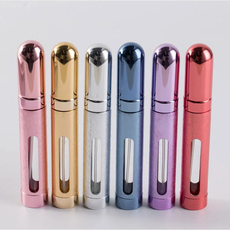 Slender silver aluminium travel perfume bottle with glass liner, shown next to a ruler indicating 115mm length.