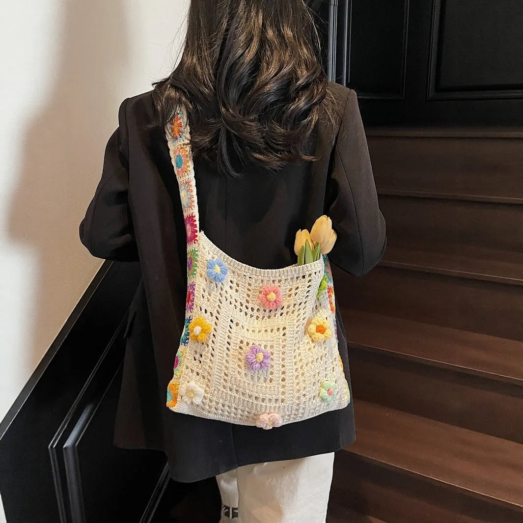 Casual woven hollow beach bag in knitted polyester, shown in milky white with a single shoulder strap.