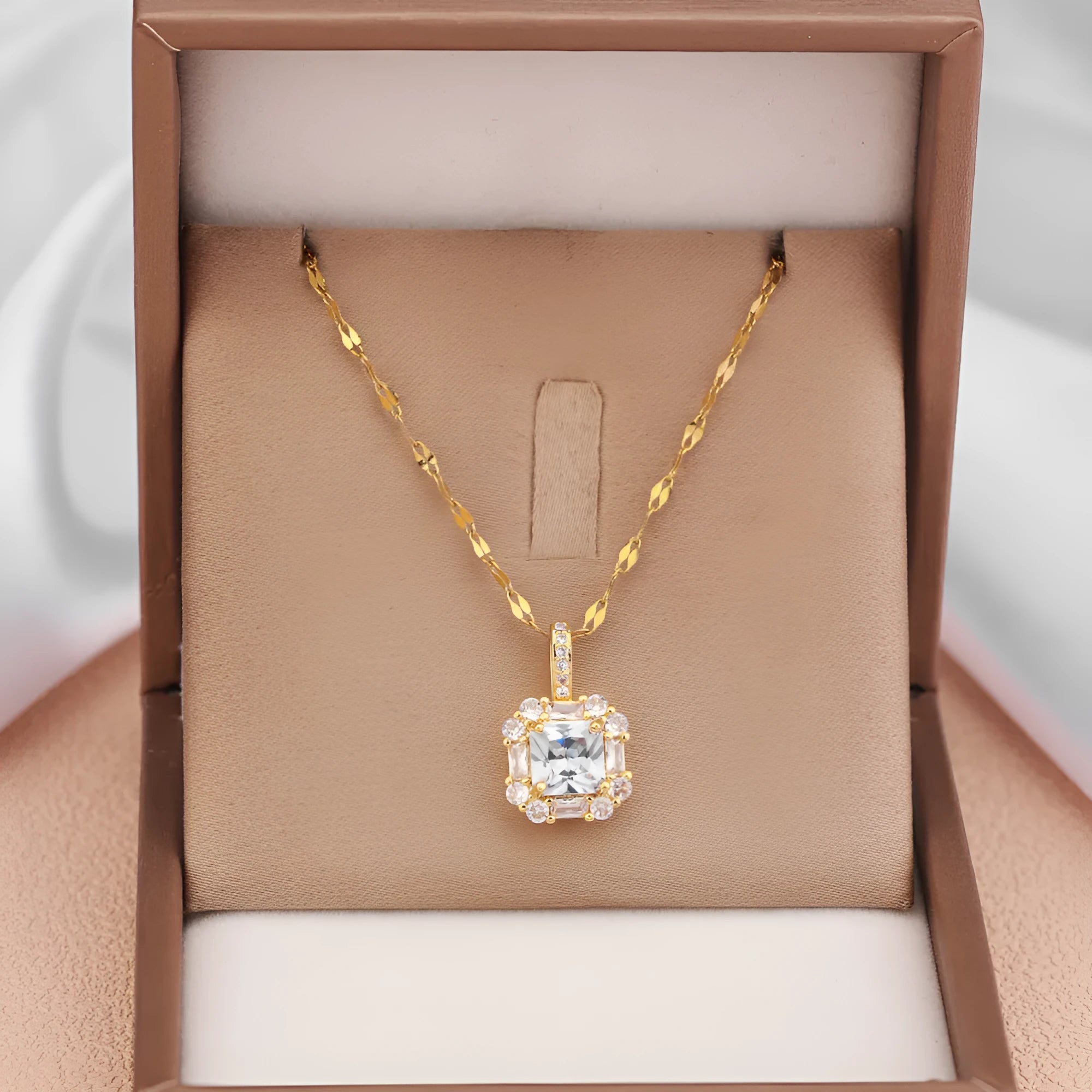 Gold titanium steel clavicle necklace with geometric quadrilateral pendant containing zircon stones