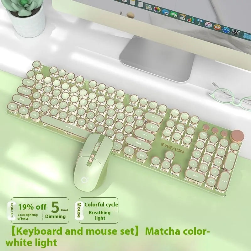 Matcha green 87-key mechanical gaming keyboard with aluminium frame and white backlighting on a desk.