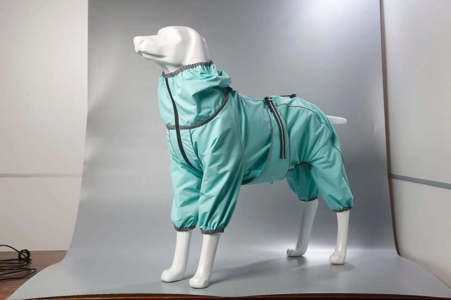 Dog wearing black cotton-padded polyester shell jacket with sports style design for winter warmth