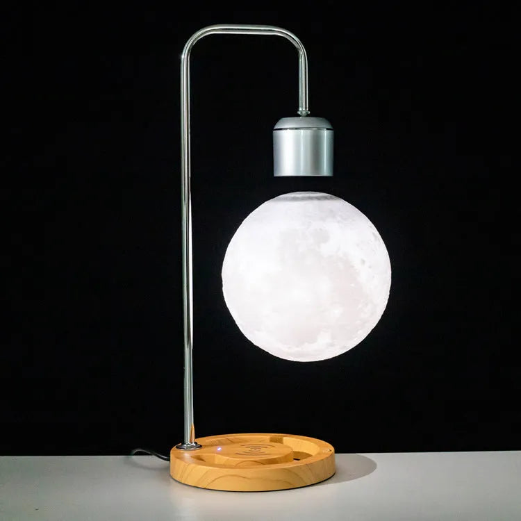 Magnetic levitation table lamp with wooden base, floating light, and optional wireless charger in colour A