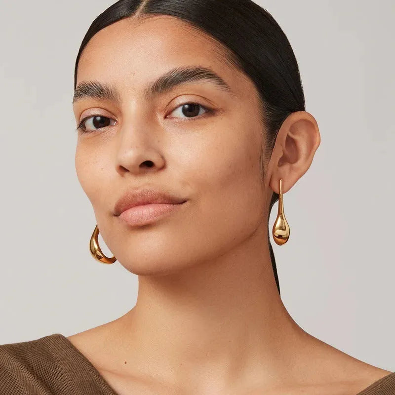 Copper plating 18K real gold irregular lines geometric needle ear studs on white background