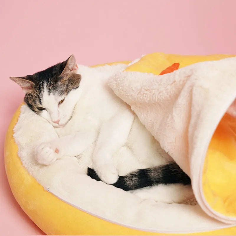 Yellow semi-enclosed carrot-shaped cat nest sleeping bag made of cotton fabric on a light background