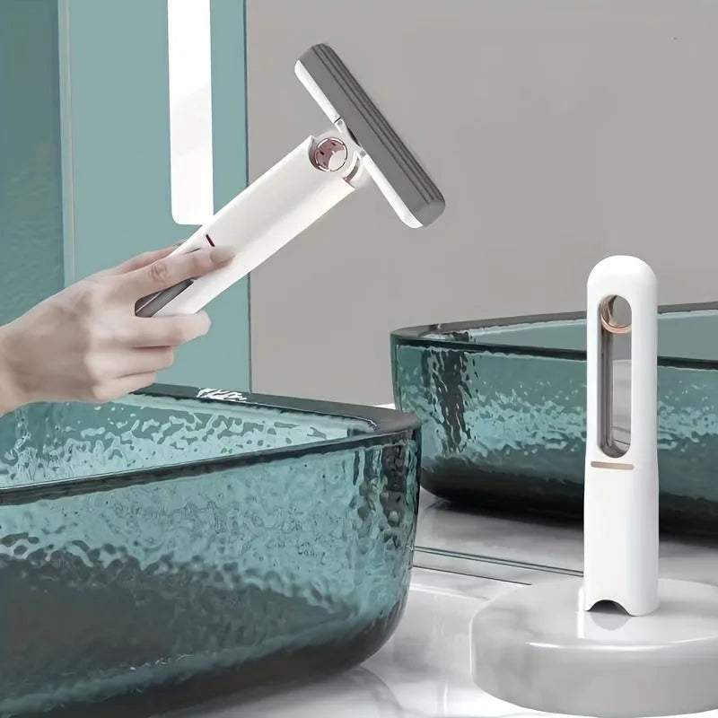 New Portable Self-Squeeze Mini Mop with hand-free wringer and biodegradable sponge on a kitchen counter