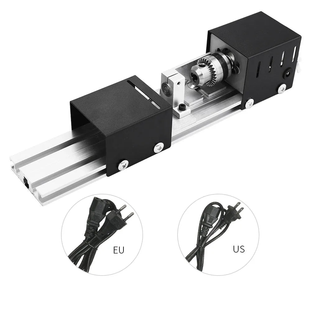Silver metal mini manual woodworking lathe with tools on a workbench