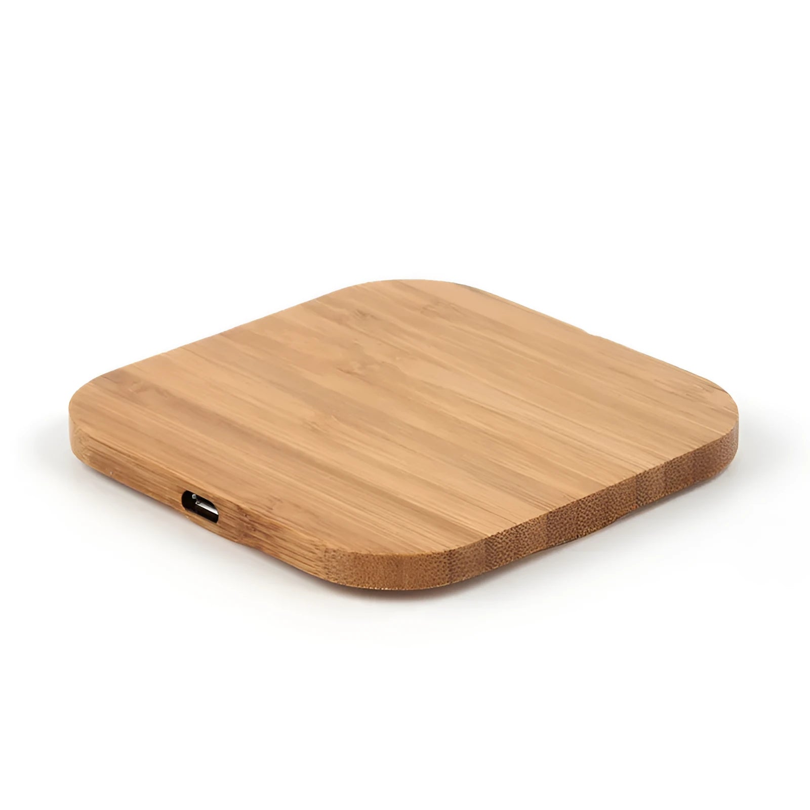 Brown heart-shaped wooden bamboo 5W Qi wireless charging pad on a desk