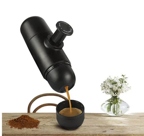 Black portable manual espresso coffee machine with stainless steel parts, shown at 17.5cm height.