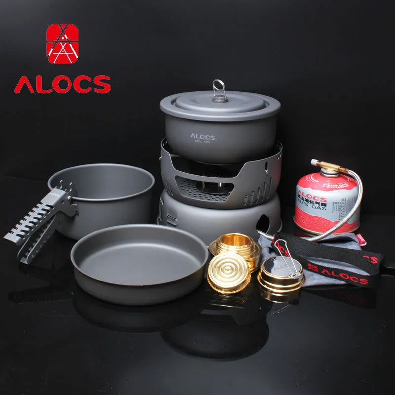 Alocs CW-K26 aluminium non-stick outdoor camping pot set stacked on a wooden table.