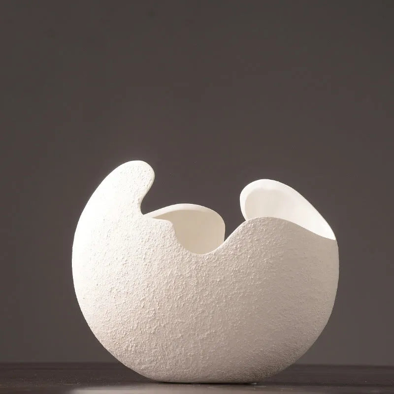 White ceramic countertop vase in simple modern style, shown in large medium and small sizes for living room desktop or study