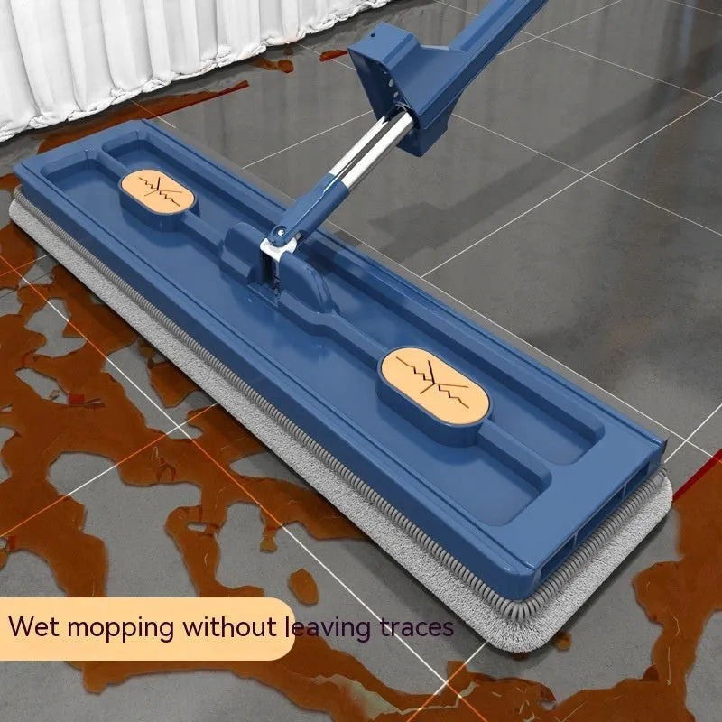Large flat mop with stainless steel long handle and blue cloth showing 360-degree rotating head mechanism