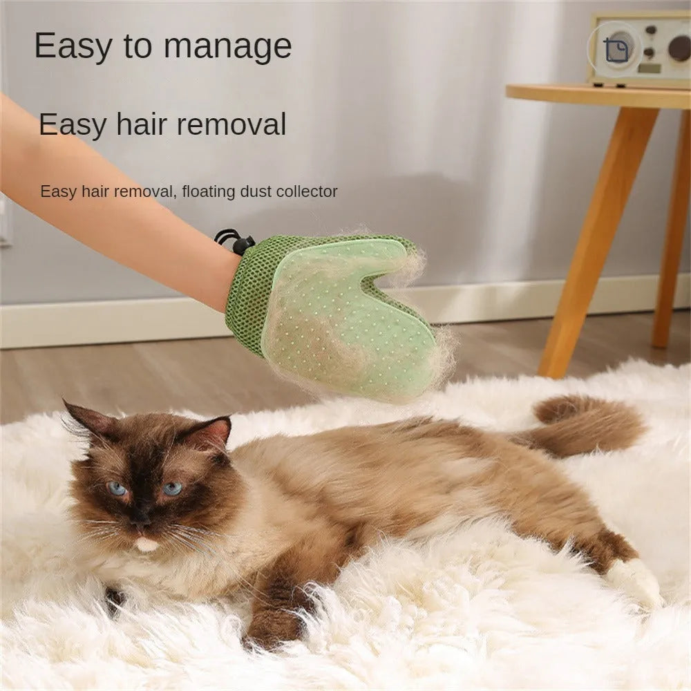 Dark blue pet hair removal glove for grooming dogs and cats on a fabric sofa.