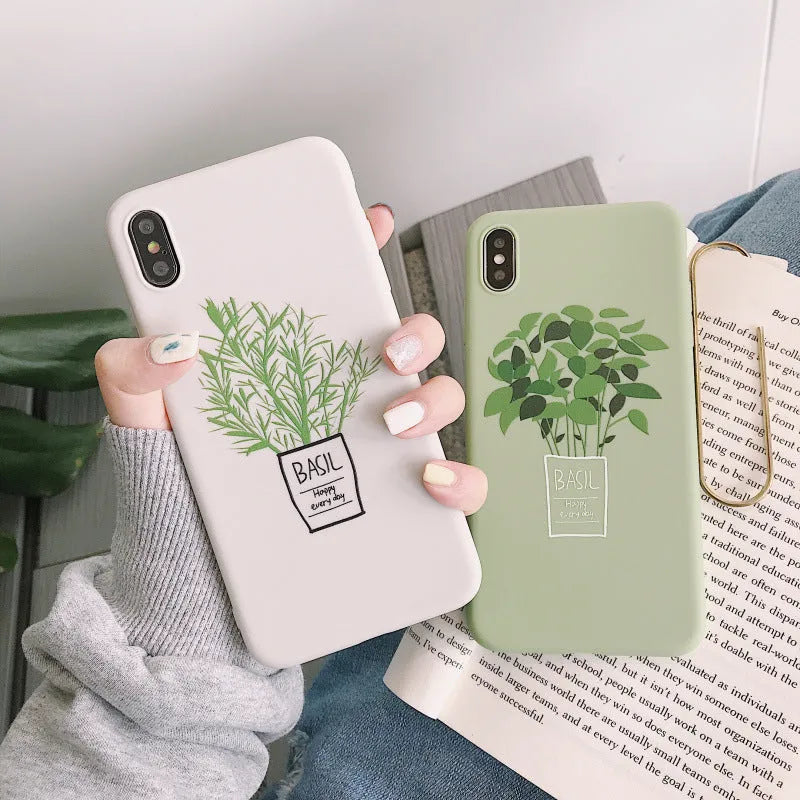 White silicone iPhone case with a detailed painted botanical plant design on the back.