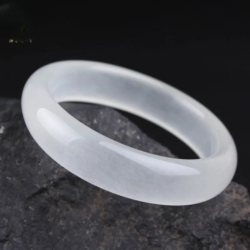 Gao Bing jade bracelet in ice-like white moonlight colour on a wrist, showing flat rod and round rod style options.