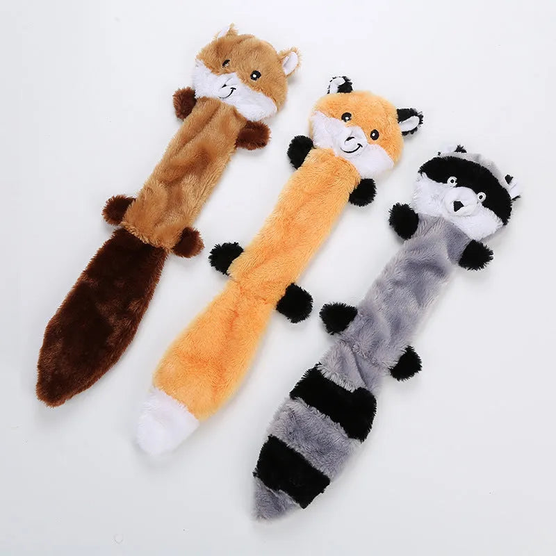 Soft plush dog toy with squeaker in multiple colours including brown, carrot orange, grey, patterned, and yellow options.