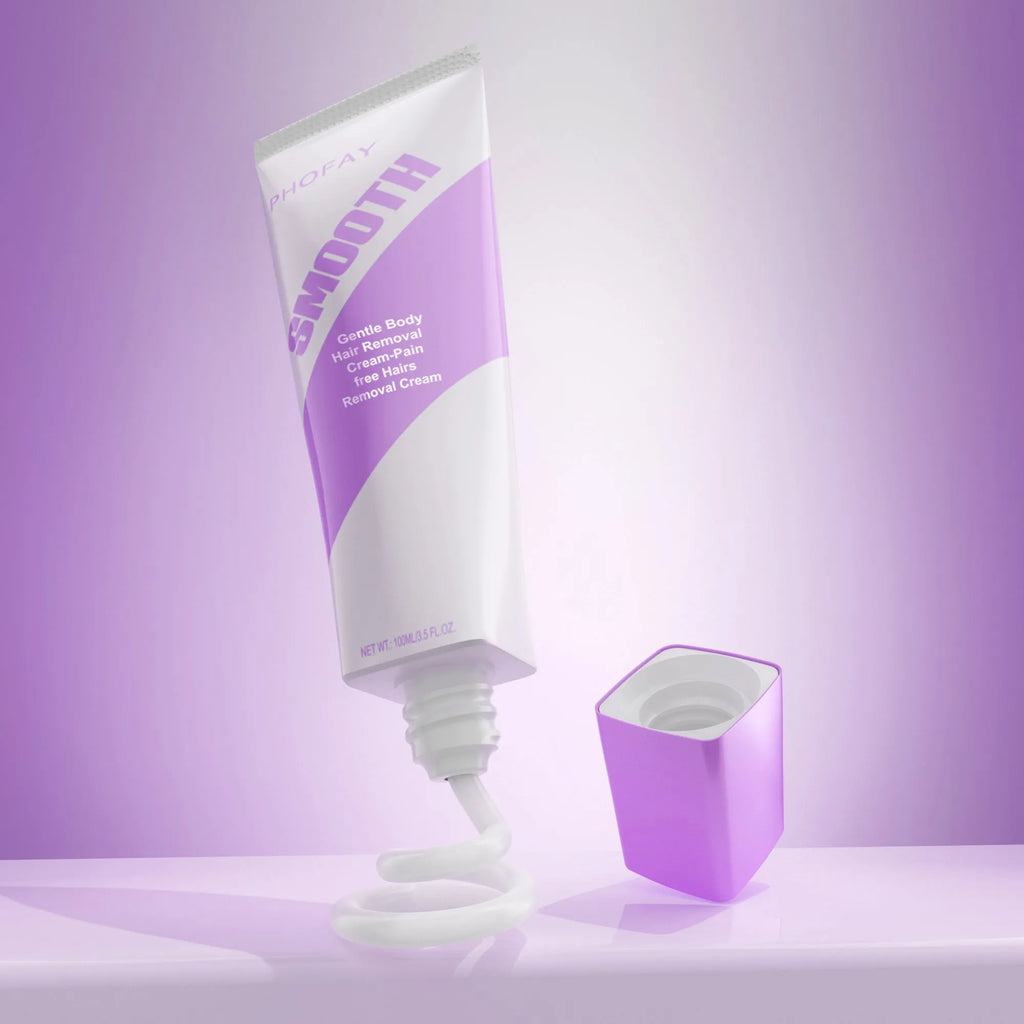 PHOFAY pain-free hair removal cream tube and plastic scraper on a pink background.