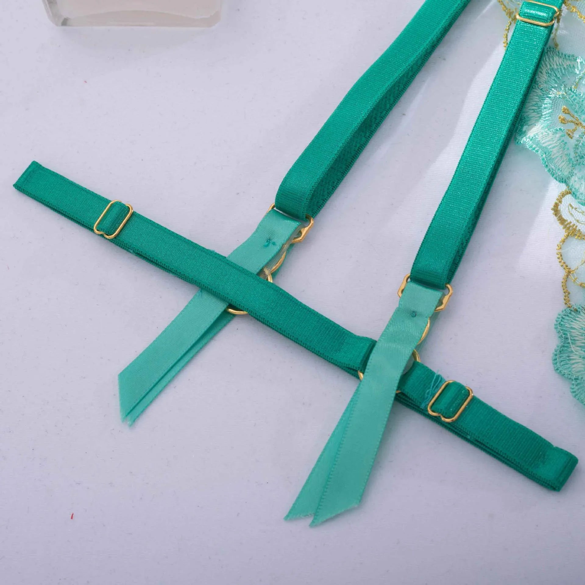 Light green embroidered women's bra and bikini set in three-point style.