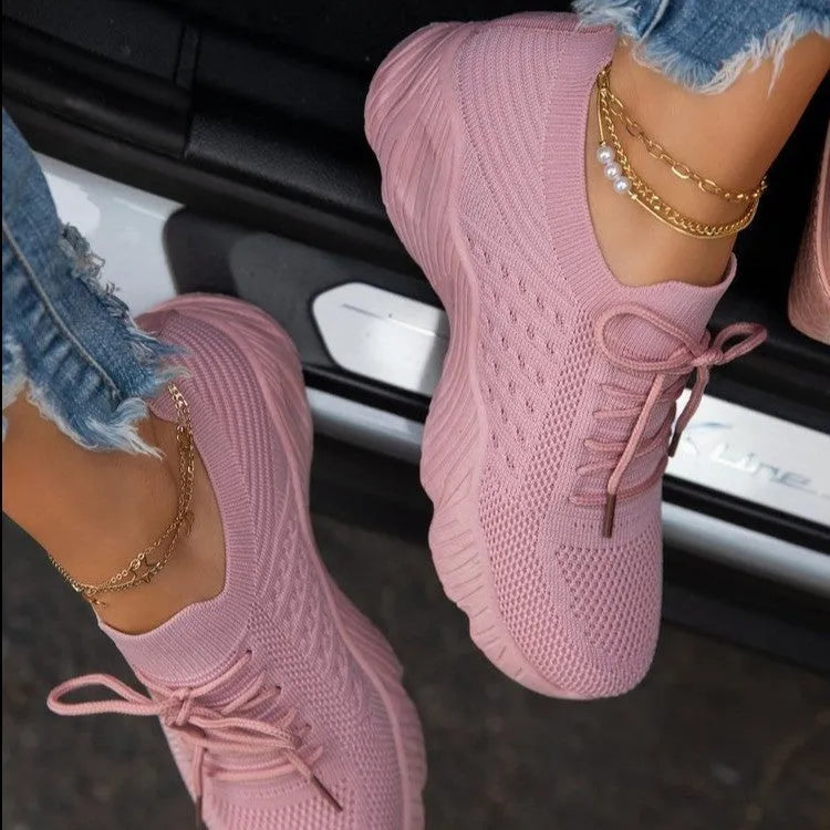 Women's solid colour sneakers with a thick sole, shown in one of nine available colours.