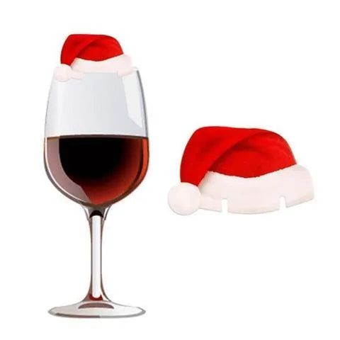 Set of 10 red non-woven fabric Santa hat decorations for wine glasses on a party table