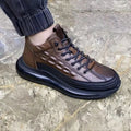 Men's high-top warm air cushion shoes in black with cowhide upper, rubber sole, elastic band, and carved detailing