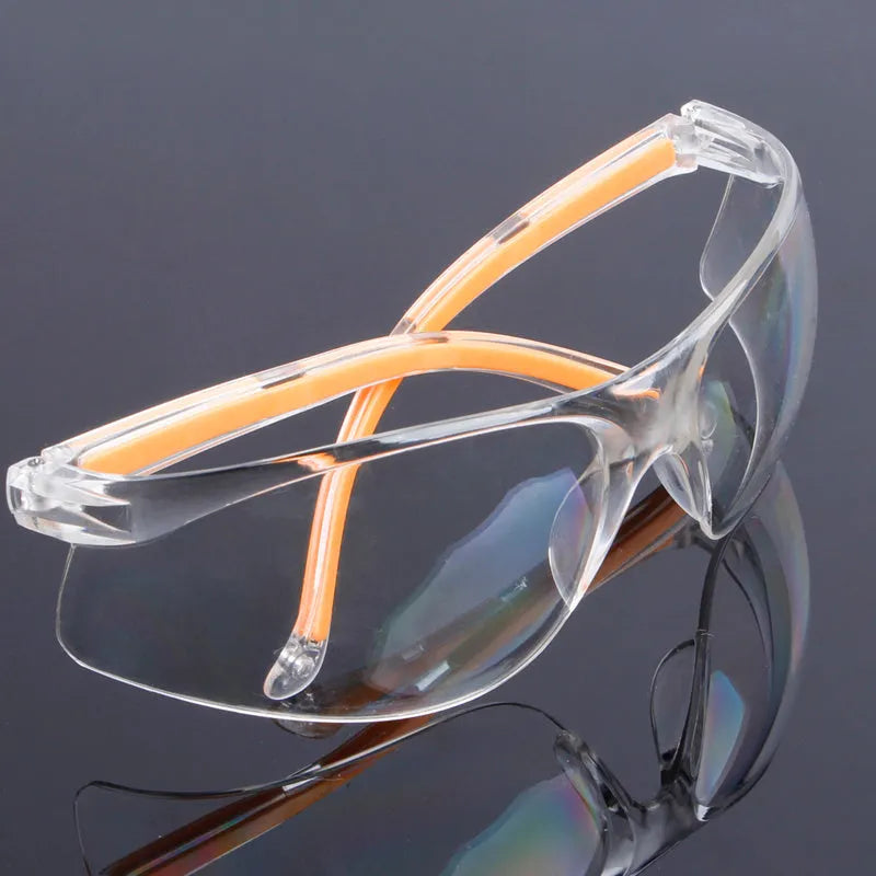 Transparent safety goggles with yellow frame made from impact-resistant polycarbonate