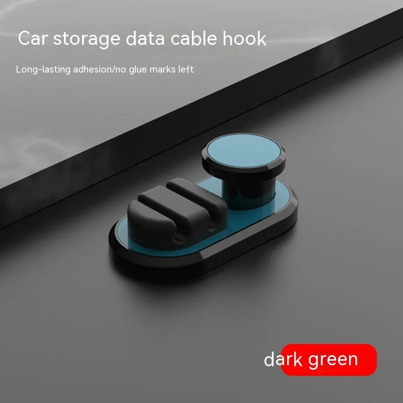 Compact dark green ABS silicone data cable storage hook for car or home use.