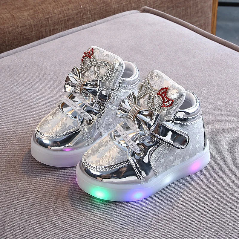 Children's LED light up shoes with button activation in golden, pink, or silvery colours