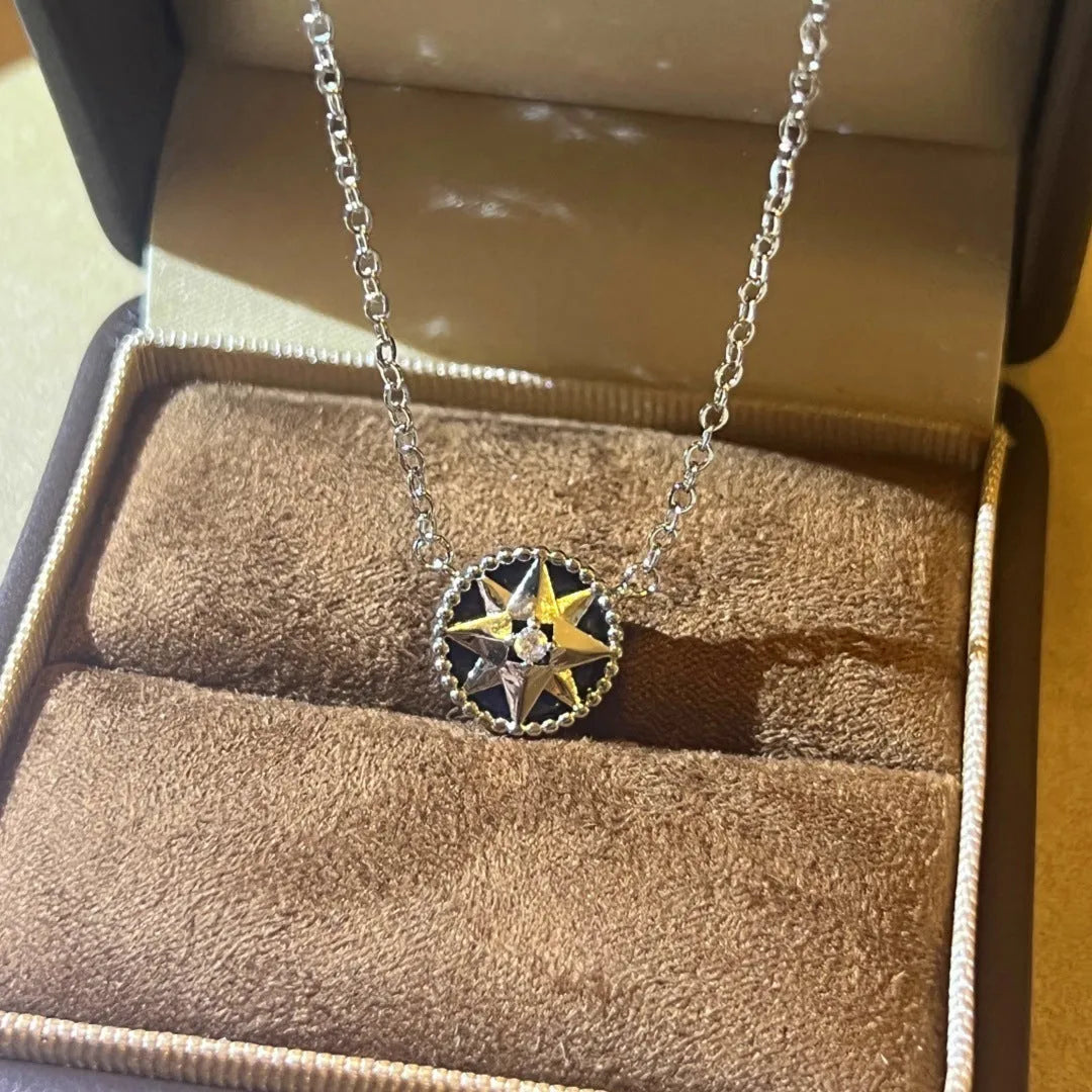 Women's compass necklace with round black agate inlay, geometric pendant, and curb chain in gold or platinum colour