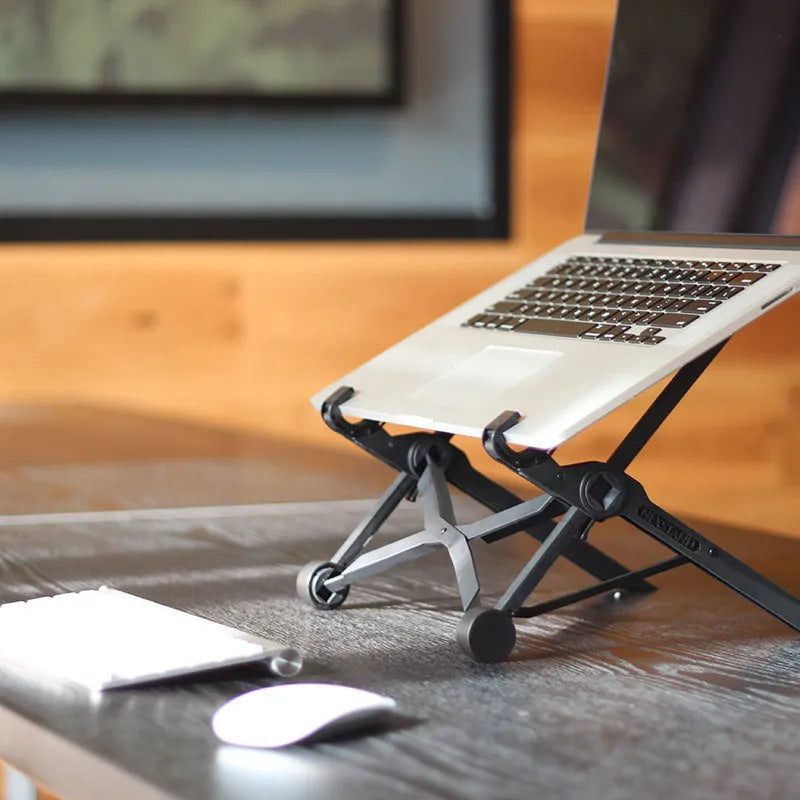 Black reinforced nylon folding laptop stand in open and closed positions