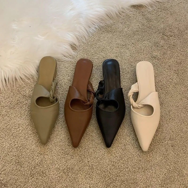 Women's soft leather slippers in dark brown with a semi-toe box design and rubber sole.