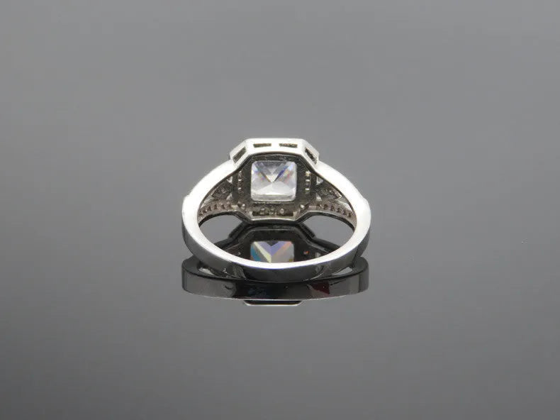 Geometric hollow zircon ring in platinum colour with quadrilateral design on copper band