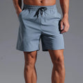 Men's loose fit casual shorts in quick-drying polyester fabric available in four colours