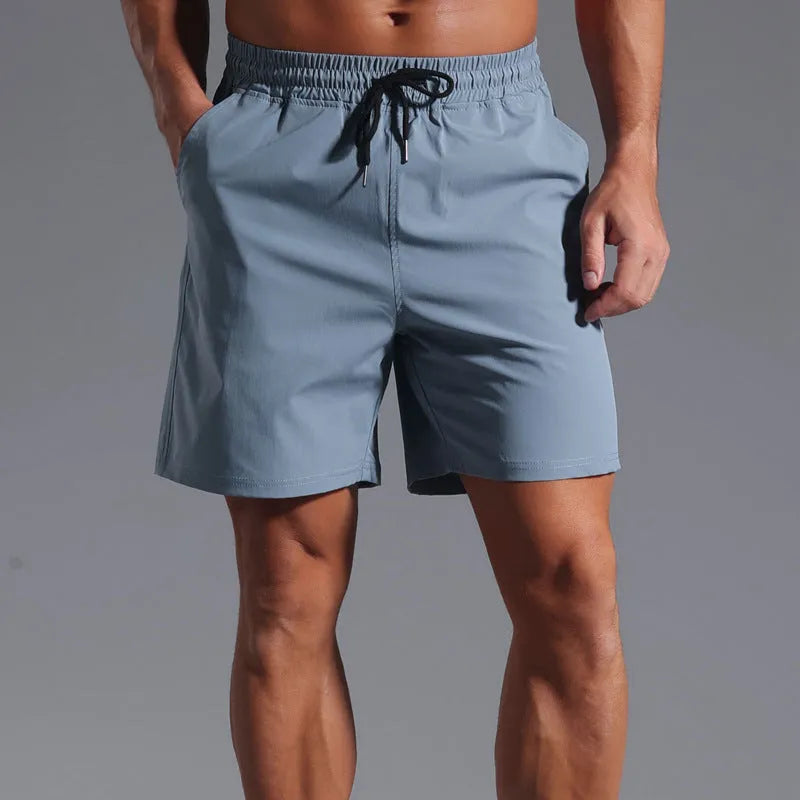 Men's loose fit casual shorts in quick-drying polyester fabric available in four colours