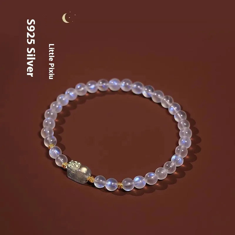 Moonstone women's bracelet with hand-ground beads and animal zodiac charms in fashion blue light colour